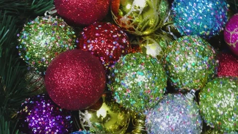 Multi-colored decorated Christmas decorations rotate in a circle Stock Footage 159187072
