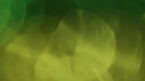 Multi-colored defocused background. Green and yellow bokeh, 4k. Video stock 100116154