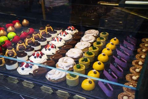 Multi-colored, different and tasty cakes on a show-window in cafe. For every Stock Photos