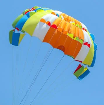 A multi-colored dome of a parachute in the sky as a background Foto stock