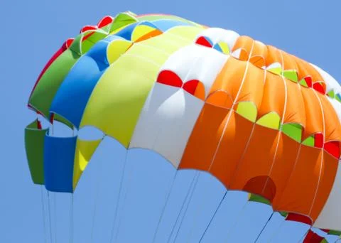 A multi-colored dome of a parachute in the sky as a background Fotos de archivo