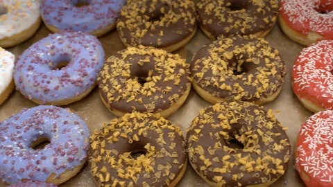 Multi colored donuts on the cafe counter Stock Footage 127189777