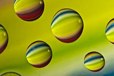 Multi-colored drops of water. Stock Photos