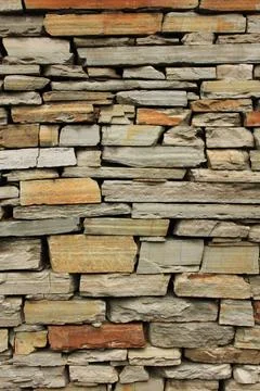 Multi colored dry stone wall in Ghandruk, Nepal. Stock Photos