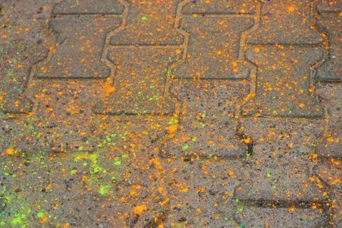 Multi-colored earth, paving slabs, powder coated with dry colors at the Holi  Stock Photos