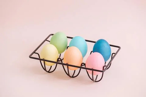 Multi-colored Easter eggs in a black stand Stock Photos