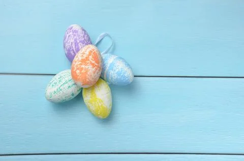 Multi-colored Easter eggs on a blue background. Stock Photos