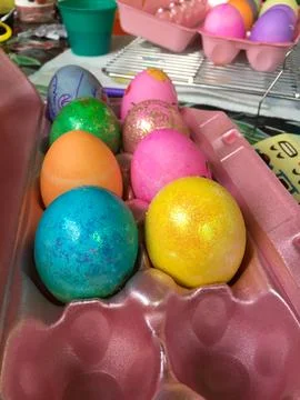 Multi-Colored Easter Eggs in a Carton Stock Photos