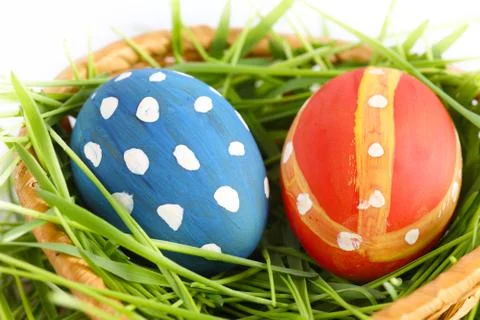 Multi-colored easter eggs on a green grass Фото