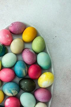 Multi-colored Easter eggs in an oval dish ,Happy Easter holiday Stock Photos
