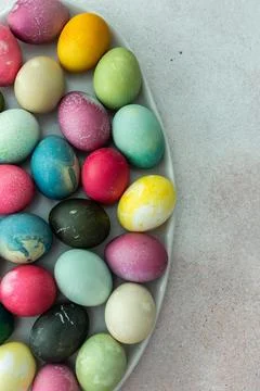 Multi-colored Easter eggs in an oval dish ,Happy Easter holiday Stock Photos