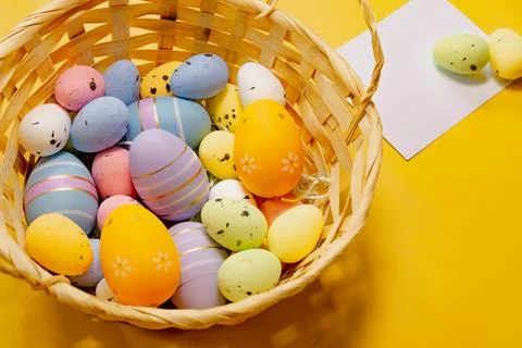 Multi-colored Easter eggs on a yellow spring background. Happy easter Foto stock