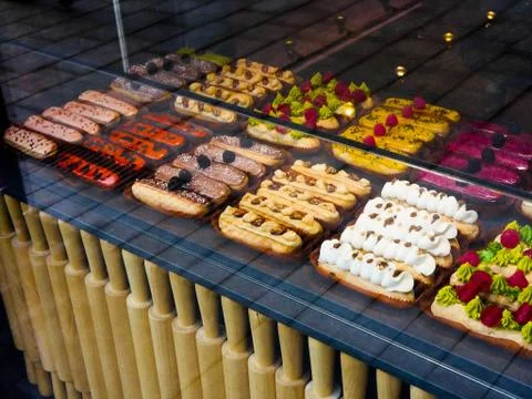 Multi-colored eclairs. Stock Photos
