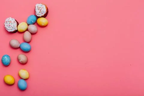 Multi-colored eggs for the Easter holiday on a pink background 库存照片