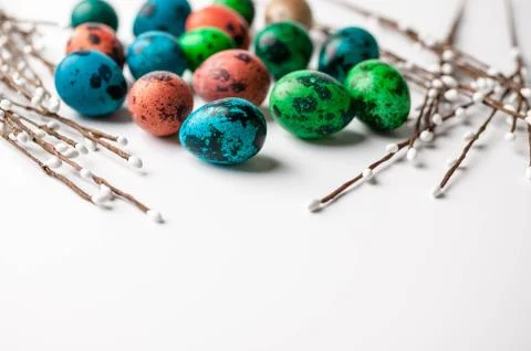 Multi-colored eggs on a light background. Easter background with copy space Stock Photos