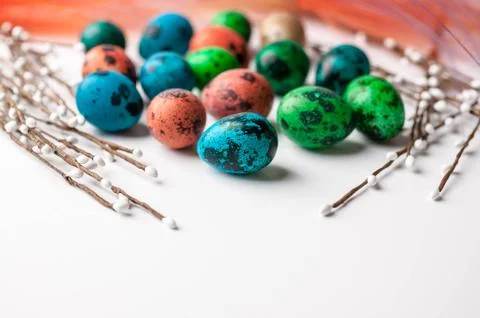 Multi-colored eggs on a light background. Easter background with copy space Stock Photos