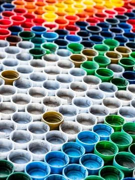 Multi-colored empty plastic bottle caps Stock Photos