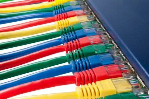 Multi colored ethernet network cables connected to a router Stock Photos