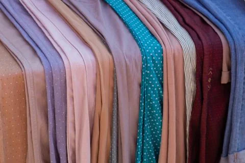 Multi-colored fabric on the counter. Layout one by one. Stock Photos