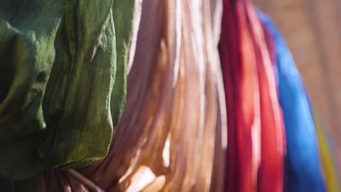Multi-colored fabrics are placed on the counter Stock Footage 259377187