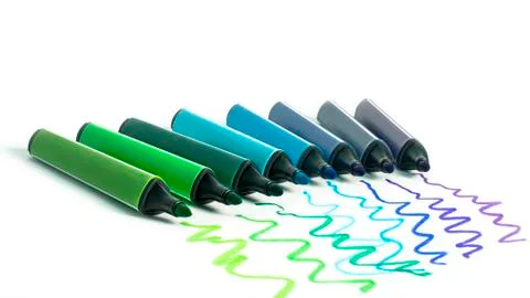 Multi-colored felt-tip pens on a white background. Tools for drawing and crea Photos