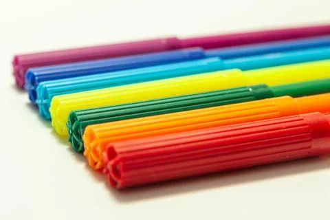 Multi-colored felt-tip pens on a white background Stock Photos