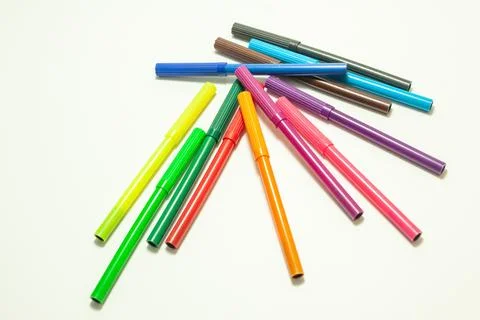 Multi-colored felt-tip pens on a white background Stock Photos