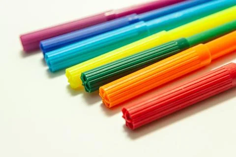 Multi-colored felt-tip pens on a white background Stock Photos
