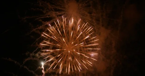 Multi Colored Fireworks Display at Summer Event with Rocket Trails and Strobes Stock Footage 111983043
