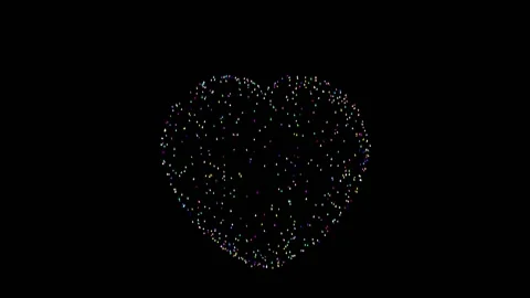 Multi-colored fireworks lights flare up against a black background, forming a Stock Footage 156311596