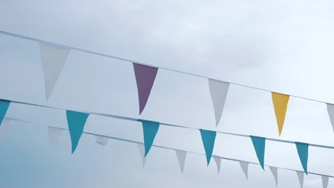 Multi-colored flags on a background of cloudy sky. Video stock 113417474