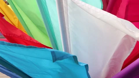 Multi-colored flags fluttering in the wind. A lot of multi-colored flags. Stock-Footage 131340570