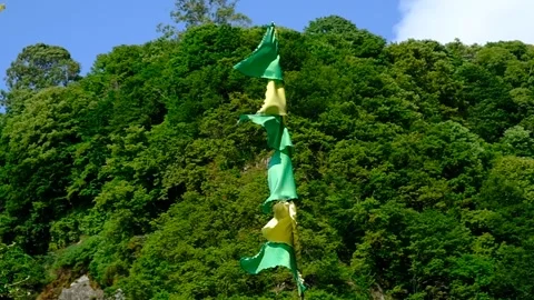Multi-colored flags waving on a flagpole. Stock Footage 134610465
