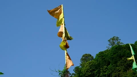 Multi-colored flags waving on a flagpole. Video stock 134610493