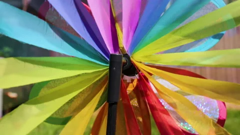 A multi-colored flying toy spinner turns beautifully from the wind. Stock Footage 245934633