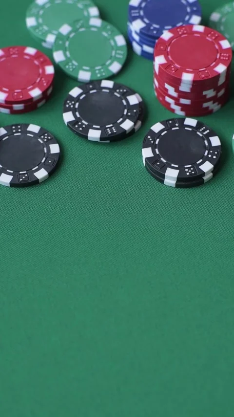 Multi colored gaming chips for betting in casino games. Betting chips 库存影片 346773135