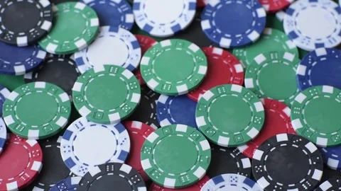 Multi colored gaming chips for betting in casino games. Betting chips 库存影片 346773136
