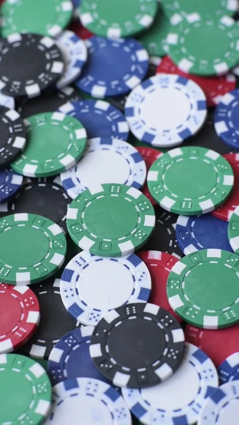 Multi colored gaming chips for betting in casino games. Betting chips 库存影片 346773139