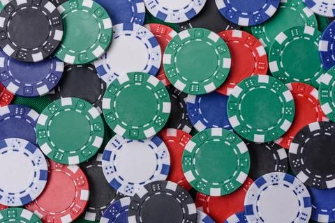 Multi colored gaming chips for betting in casino games. Betting chips Stock Photos