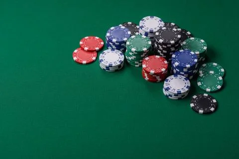 Multi colored gaming chips for betting in casino games. Betting chips Stock Photos