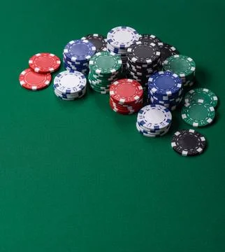 Multi colored gaming chips for betting in casino games. Betting chips Stock Photos