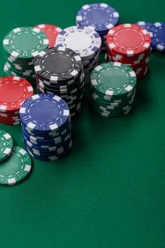 Multi colored gaming chips for betting in casino games. Betting chips Stock Photos