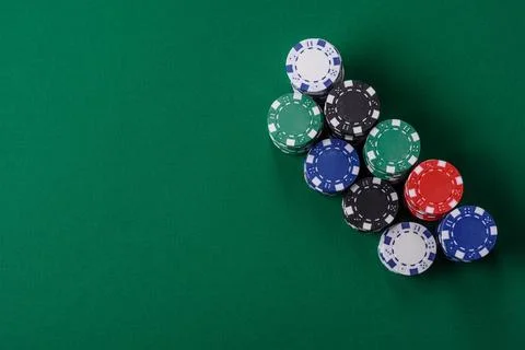 Multi colored gaming chips for betting in casino games. Betting chips Stock Photos