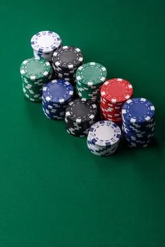 Multi colored gaming chips for betting in casino games. Betting chips Stock Photos