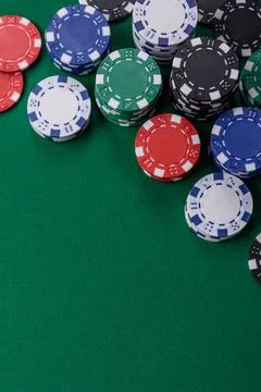 Multi colored gaming chips for betting in casino games. Betting chips Stock Photos