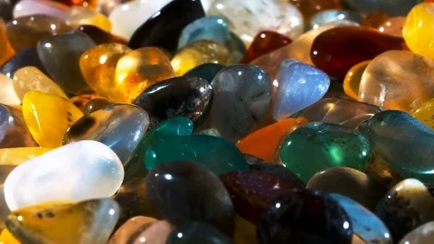 Multi-colored Gems Sparkle on a revolving Background Stock Footage 78884279