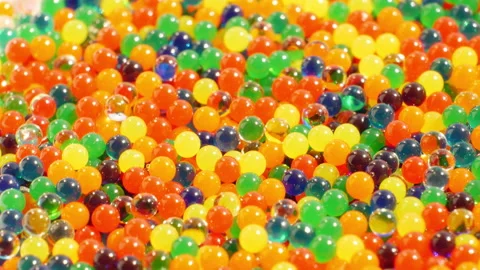 Multi-colored glass beads. Smooth rotation. Super magnification Stock Footage 132192217