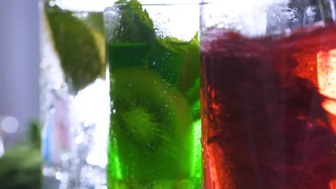 Multi-colored green and red holiday cocktails close-up. Carbonated Beverage. 스톡 동영상 120431117