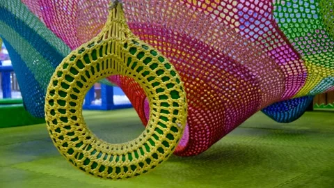 Multi colored grid in the playroom for  games and entertainment, rope net Stock Footage 310102902