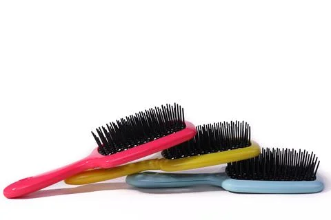 Multi-colored hair combs on an isolated white background. Foto stock